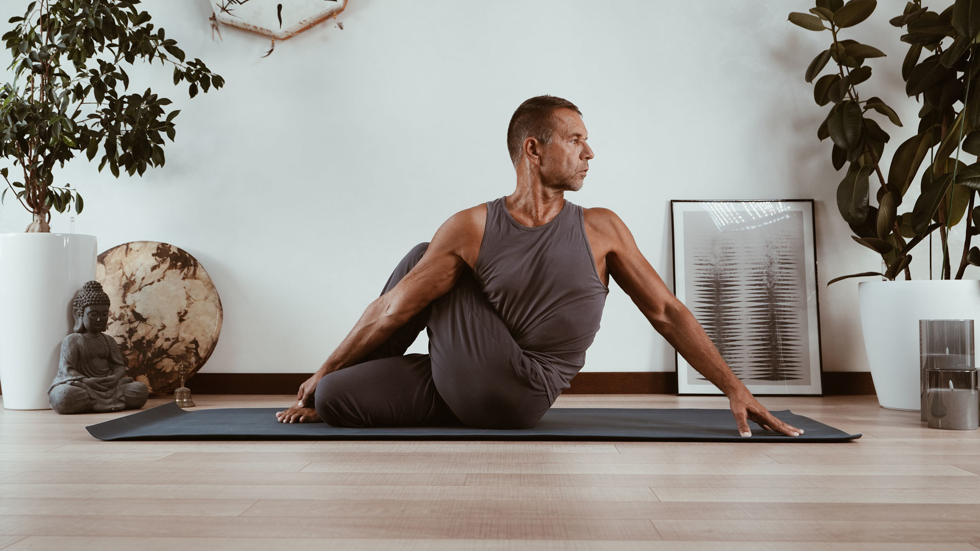 Yoga studio desk with practice notes, a journal, and props arranged for a mindful session