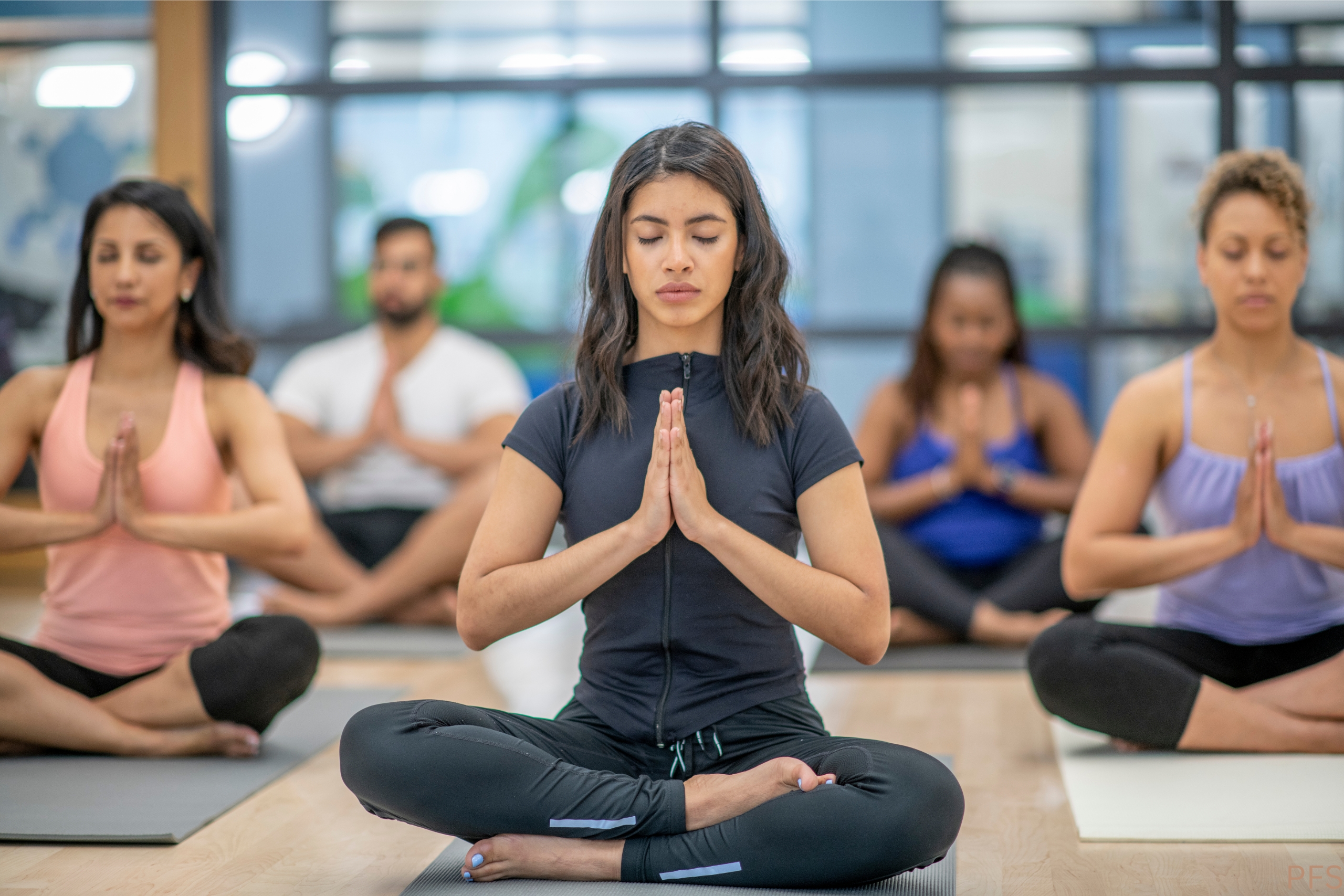 Yoga mats, blocks, and practice notes arranged in a peaceful studio setting