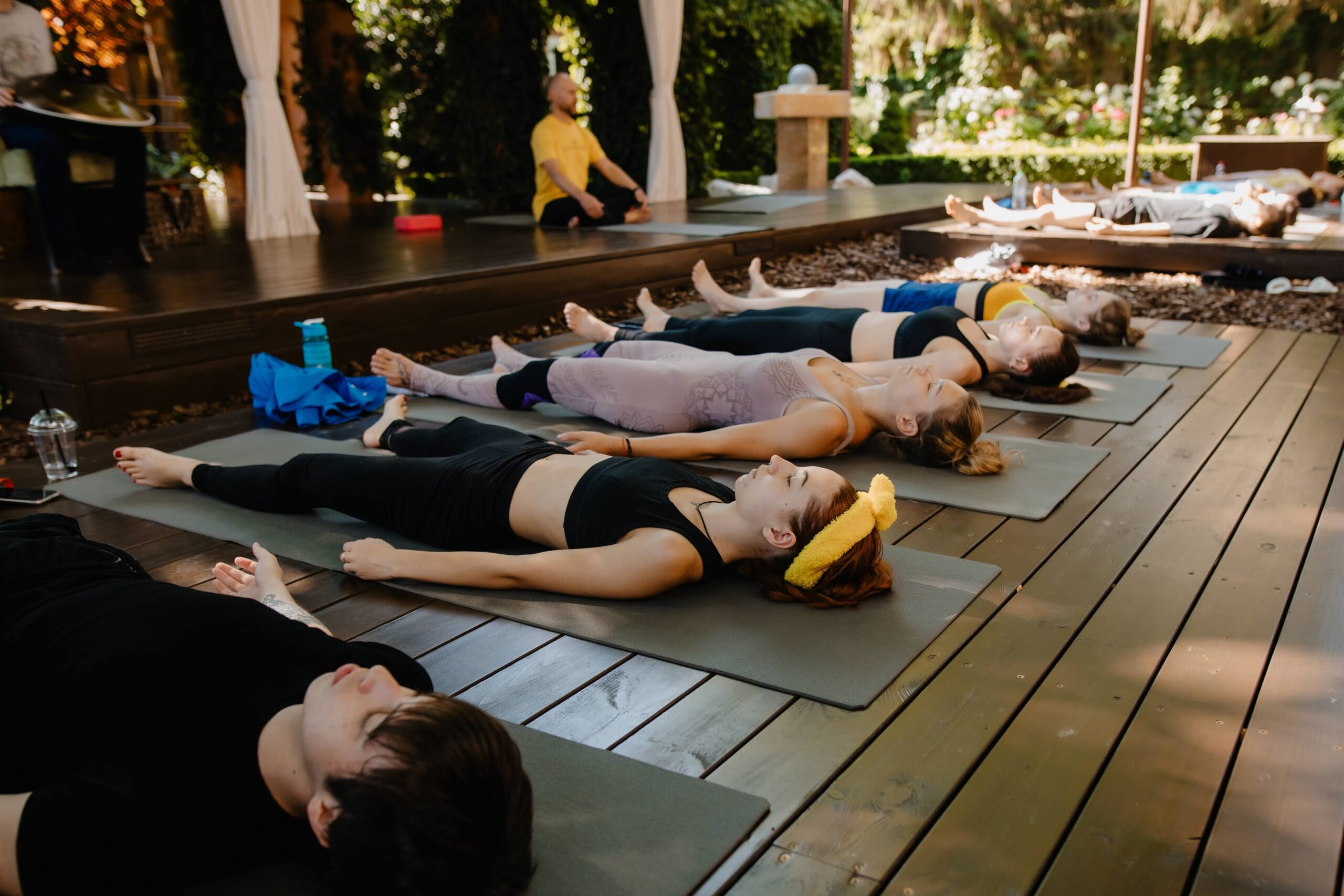 Quiet yoga studio with soft lighting and a comfortable space for relaxation after practice